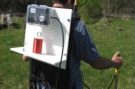 Field technician and survey data logger used during close-interval potential surveying.
