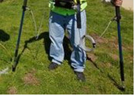 Field technician carrying out a direct-current voltage gradient survey with ground probes.