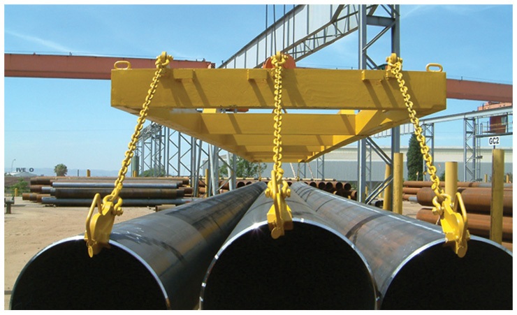 Lifting beam, slings and hooks handling steel pipe.