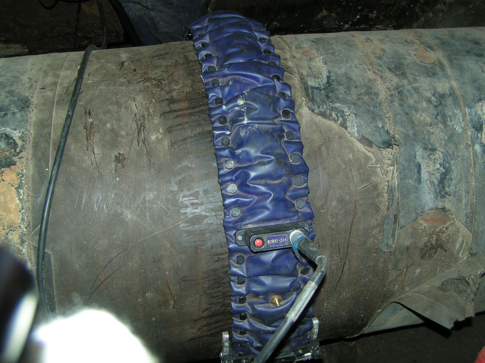 Guided-wave ultrasonic transducer ring fitted around a pipe.